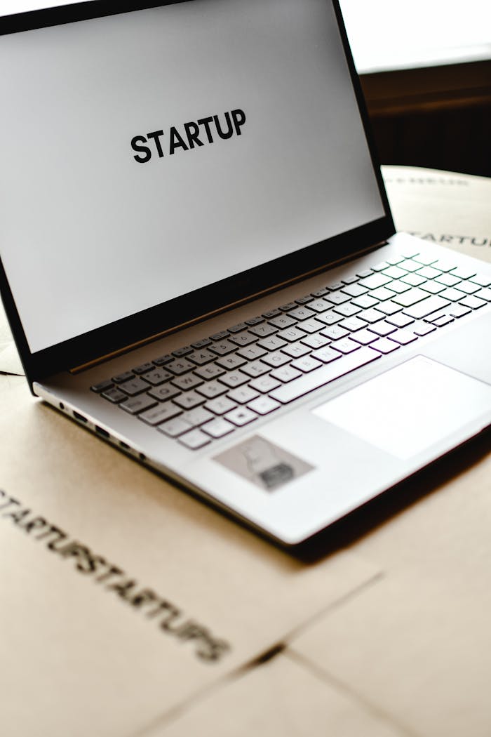Services Modern laptop with startup text on screen, ideal for business themes.