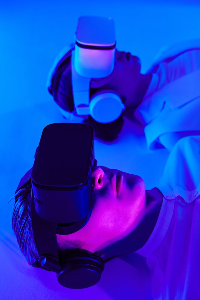Services Close-up of people using VR headsets in vibrant studio lighting, showcasing modern technology.